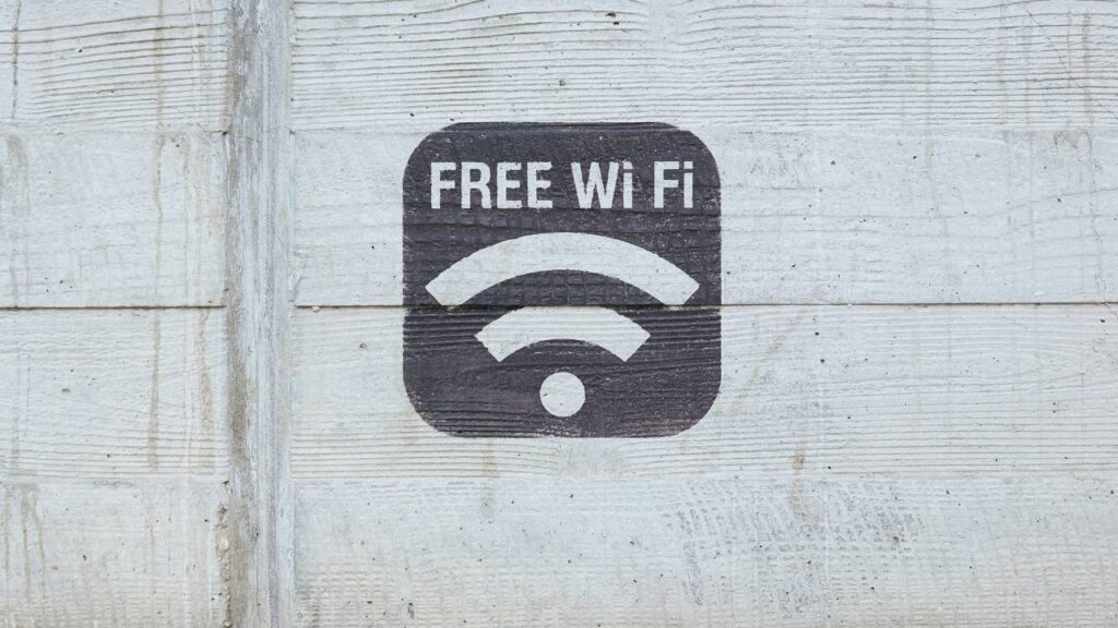 A symbol saying "free Wi-Fi" painted on a wooden wall