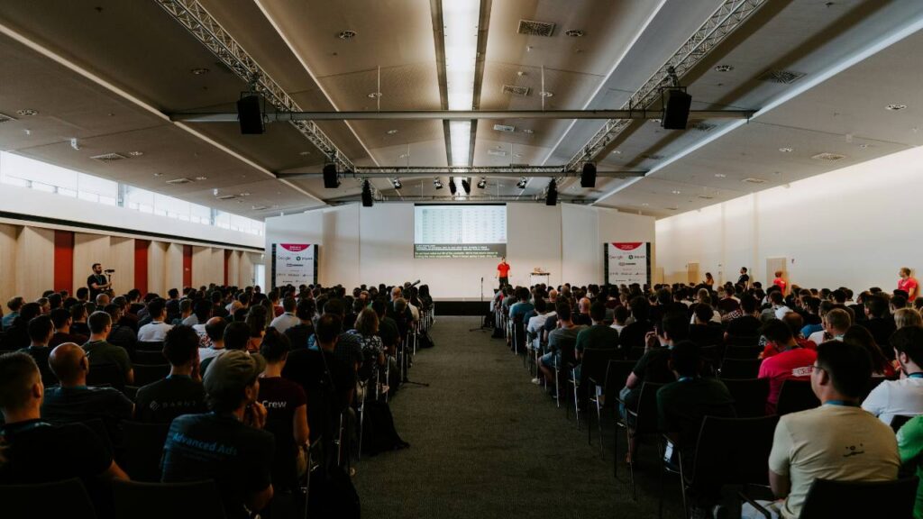 A business conference taking place in a large room