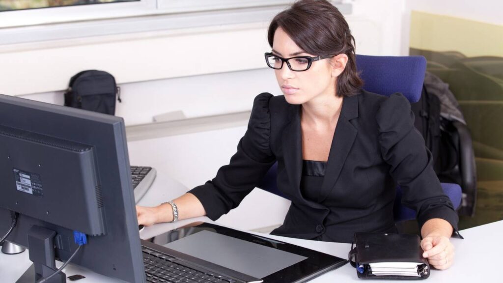 A young female employee working on a computer